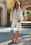 Spell women's 1979 Denim Short in Salt, white organic cotton raw hem shorts, styled with lace blouse