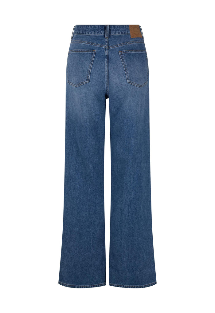 Back flat lay of 1995 Baggy Jean in washed indigo, showing back pockets and custom Spell leather tab trim