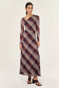 Woman wearing a plaid dress on a white background