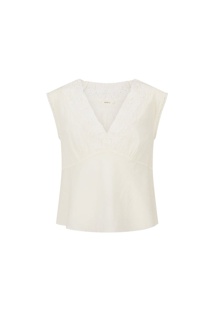 An off-white sleeveless top with a V-neckline and subtle lace detailing on the chest, presented on a solid white background.