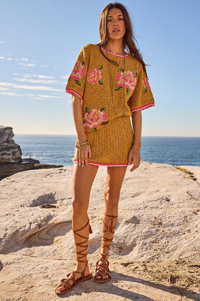 Spell women's Coastal Granny Mini Skirt mustard knit crochet with pink rose embroidery, styled with matching top