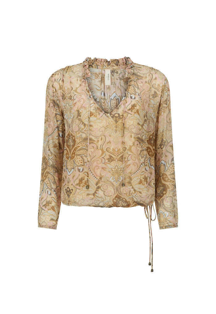 A long-sleeve blouse with a beige and gold paisley pattern, featuring a split V-neckline with tie-front lacing and a drawstring detail at the side hem.