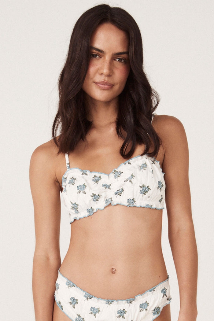 Front view of ruched block print bralette with babylock edges and adjustable straps, styled with matching briefs