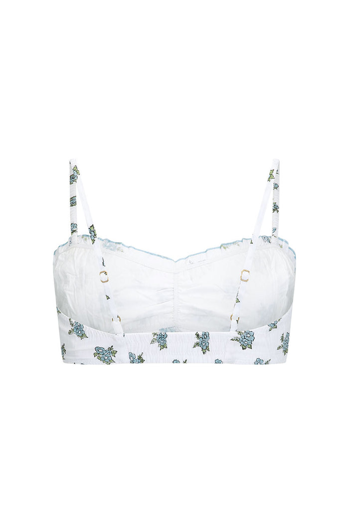 Fable Block Printed Bralette flat lay, white with blue floral print, ruched centre front, babylock edges, gold ring details
