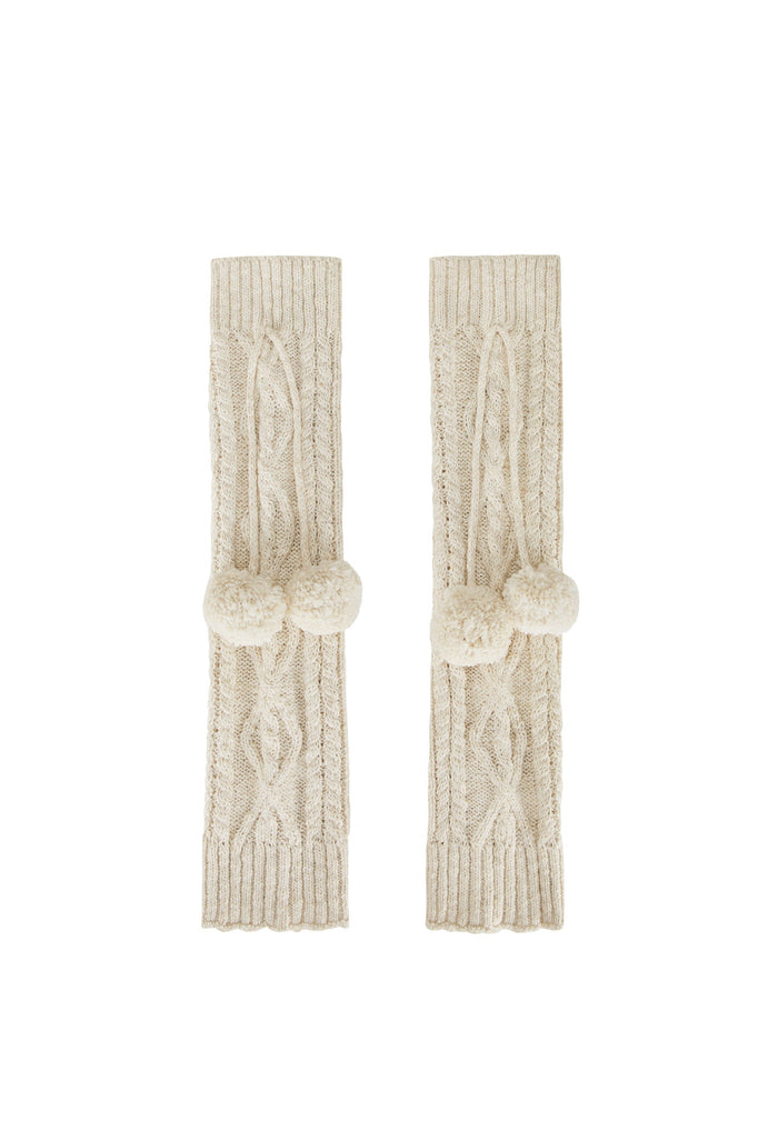 A pair of cream-colored cable-knit arm warmers with matching pom-pom details, displayed flat against a solid white background.