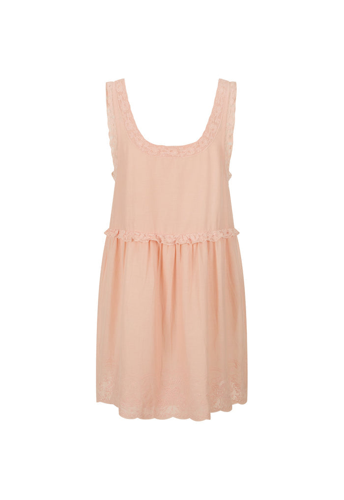 A sleeveless light peach-pink nightgown with a scoop neckline, delicate lace trim, and a gathered waist, shown against a plain white background.