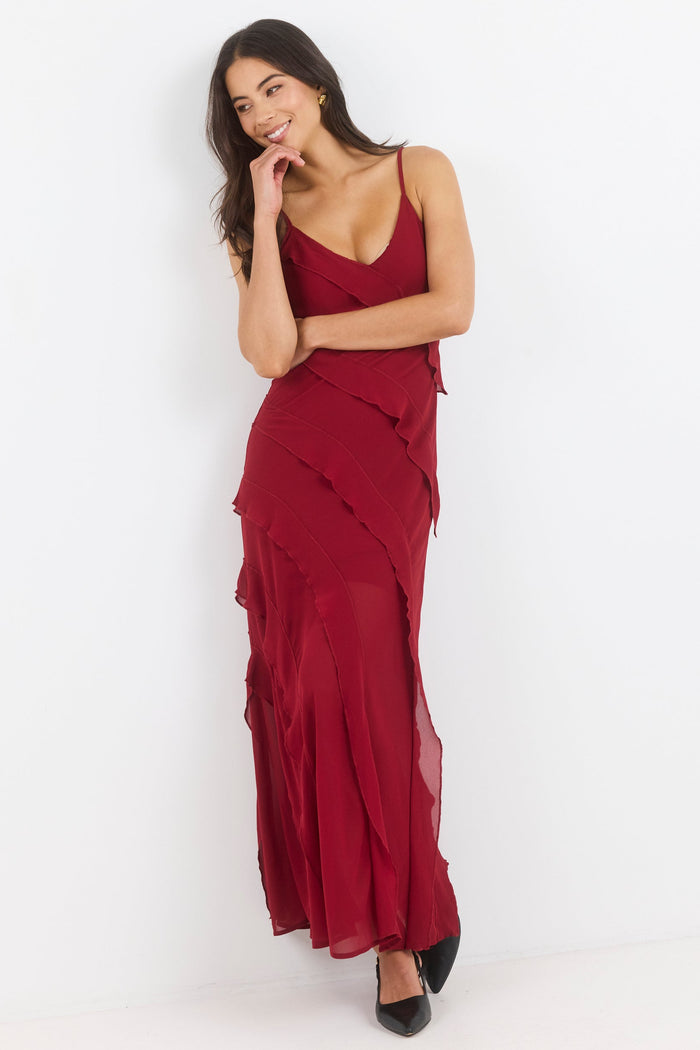 Woman wearing a red dress against a white background