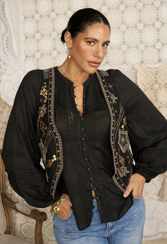Front view of black Hera Lace Blouse showing gold sequin embroidery vest overlay, pintuck detail and button front