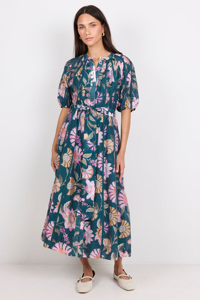 Woman wearing a floral dress on a white background
