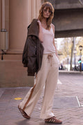 Spell women's Kansas Track Flare Pant in Stone hemp organic cotton with contrast side stripe and drawstring waist