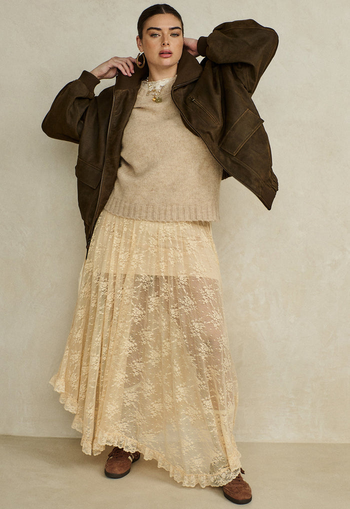 Peach Bliss lace maxi skirt flat lay showing floral lace fabric, hi-lo hem, and scalloped lace trim edge