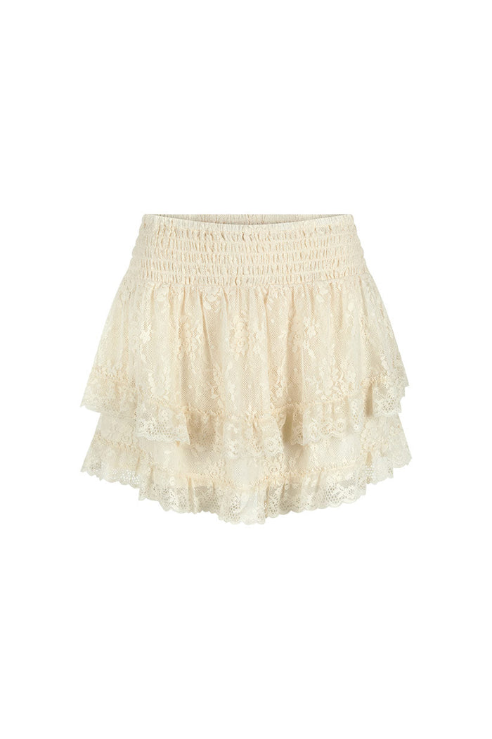 Cloud cream lace mini skirt flat lay, front view showing shirred waist and double-layered lace hem trim