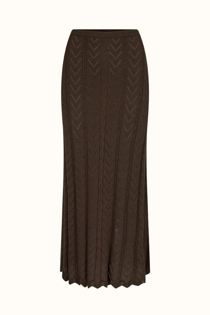Brown pointelle knit maxi skirt with chevron pattern, elasticated waist and scallop hem, laid flat on white background