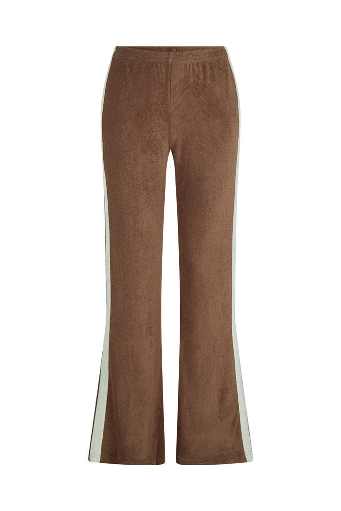 Front flat lay of chocolate terry flares with cream contrast side stripe and elastic waist on white background