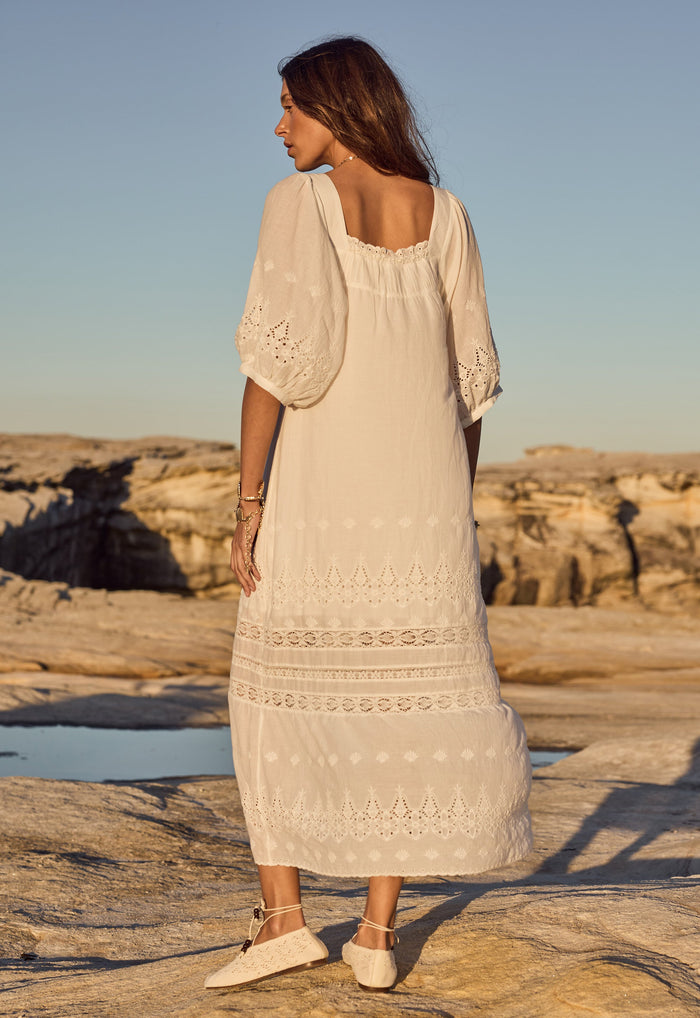 Back view of Maiden Lace Midi Dress showing square neckline, broderie anglaise sleeves and lace trim hem bands
