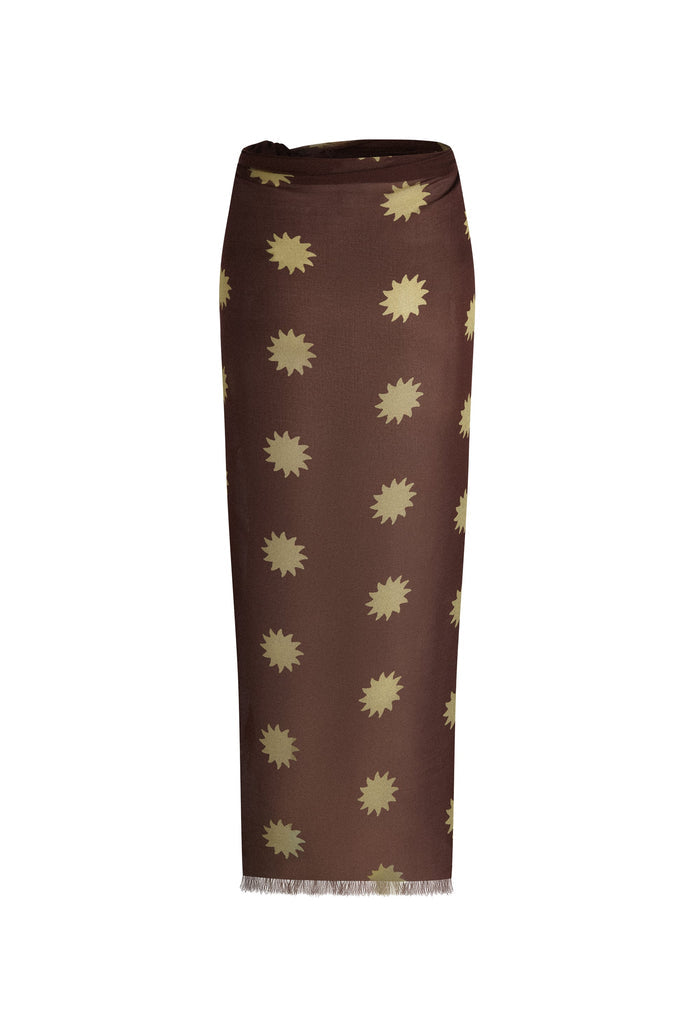 Melo Brown travel scarf styled as wrap skirt, chocolate modal with golden sun print and frayed hem, white background