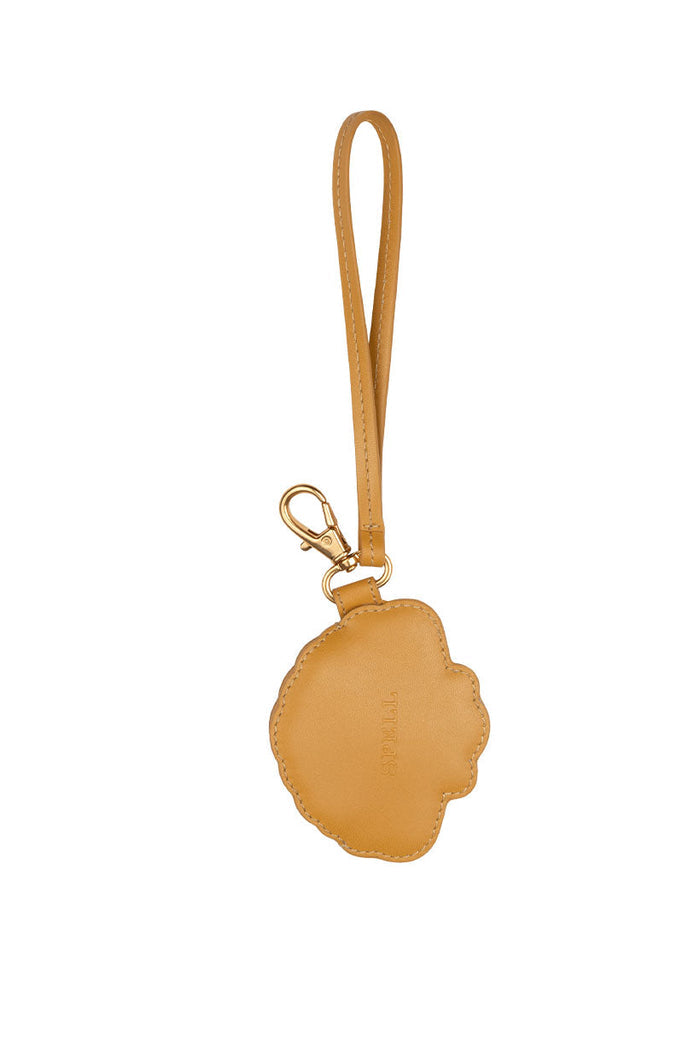 Back view of mustard leather Mermaid Shell Coin Purse showing gold lobster clasp and wrist strap