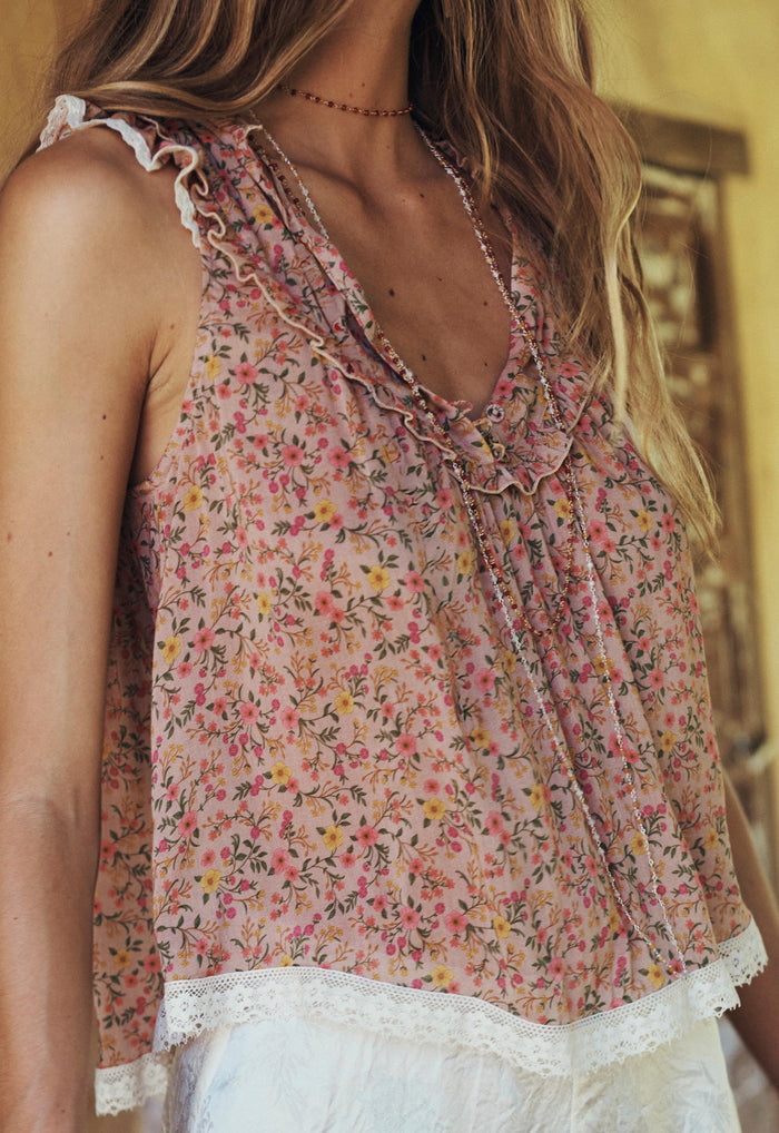 Front view of Pink Posey floral top showing lace hem trim, frill neckline, and gathered armhole frills on neutral background