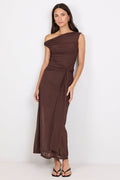 Woman wearing a brown one-shoulder dress on a white background
