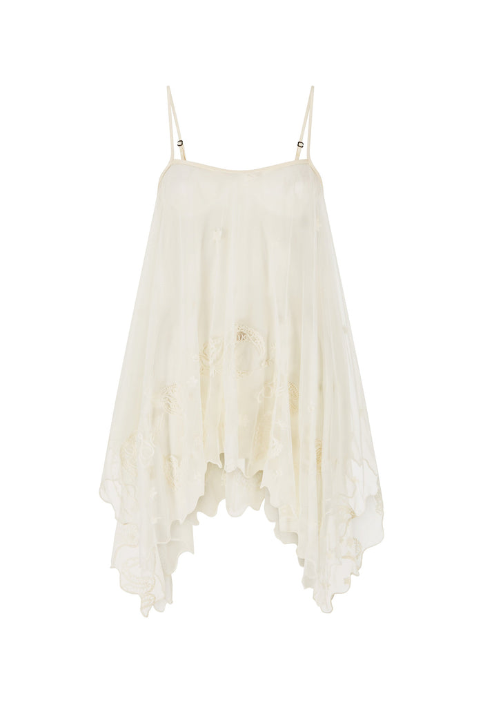 An off-white, semi-sheer spaghetti strap dress with a tiered, ruffled asymmetrical hem and delicate floral embroidery, shown against a plain white background.