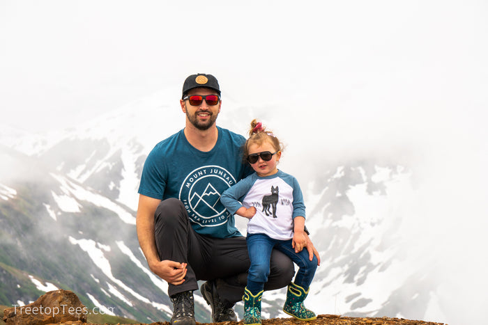 on top of Juneau Mountain wearing Mt. Juneau Hat and Shirt