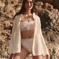 Spell women's Pfeiffer Shirt in Antique Creme with scallop lace and eyelet embroidery, worn open at rocky beach