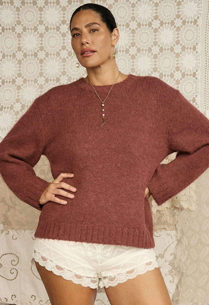 Model wearing Plum & Lucy cocoa alpaca-wool sweater front view, ribbed neckband and cuffs, lace shorts styled beneath