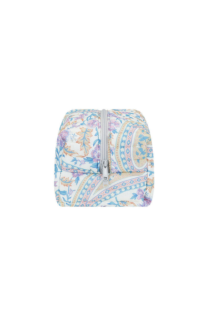 Back view of quilted make up bag in pastel paisley floral print with silver zip closure on white background