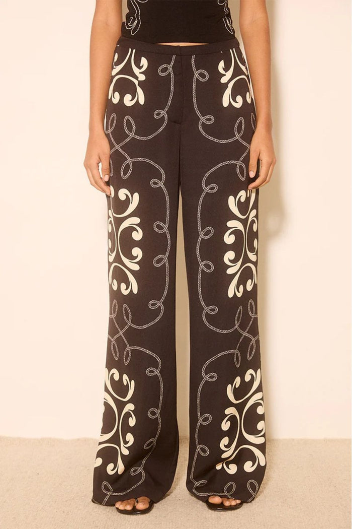Woman wears a black and white print matching set