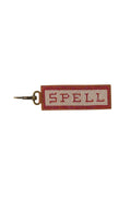 Spell Beaded Key Ring in Pink with cream and red seed bead logo on tan leather backing