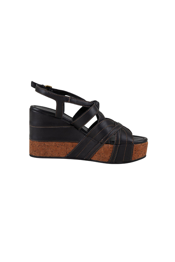 Side view of Starlet Wedge in Onyx showing cork veneer sole, leather straps with contrast topstitching