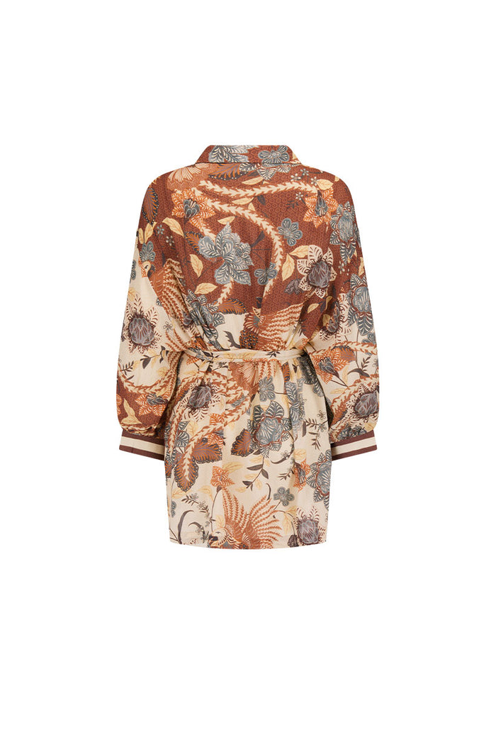 Back flat lay of Volcano Goddess Shirt Dress in Coconut, showing waist tie, striped cuffs, and allover floral print